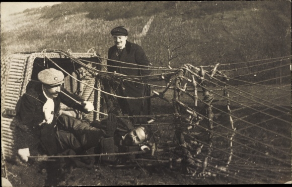 Photo Postcard Men in a fallen hot air balloon basket