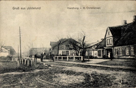 Ak Joldelund Noord-Friesland, straatgedeelte, winkel H. Christiansen