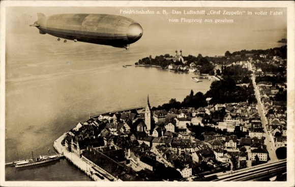 Postcard Friedrichshafen on Lake Constance, airship LZ 127 Graf Zeppelin in full flight, aerial photograph