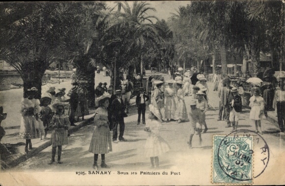 Postcard Sanary sur Mer Var, Under the palm trees at the harbor, lots of people, pretty hats