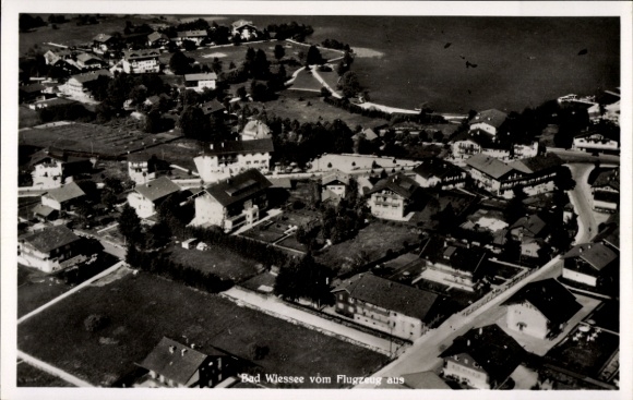 Postcard Bad Wiessee in Upper Bavaria, aerial view of many houses, waters, surrounding nature