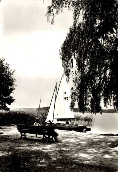 Postcard Teupitz in der Mark, sailing boat on the water, people sitting on a bench, trees