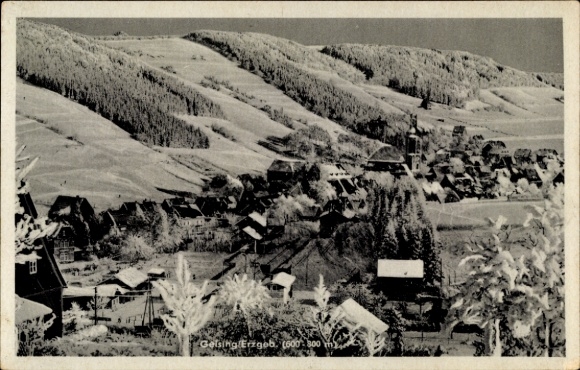 Geising Altenberg in the Ore Mountains, snow-covered hills, village view, church, old houses, Wi...