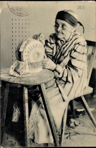 Postcard Woman making bobbin lace, bobbin lace work