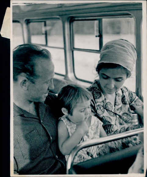 Photo of cosmonaut Alexei Leonov, with his wife and daughter, Viktoria and Svetlana, in a bus, 1965