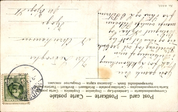 Postcard Man with torn trousers reading a letter.