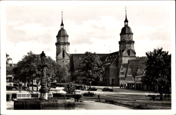 PC Freudenstadt in the Black Forest, two towers, statue, trees, cars, market square