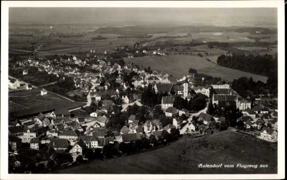 Postcard Aulendorf in Württemberg, aerial view of town with church, landscape in the background