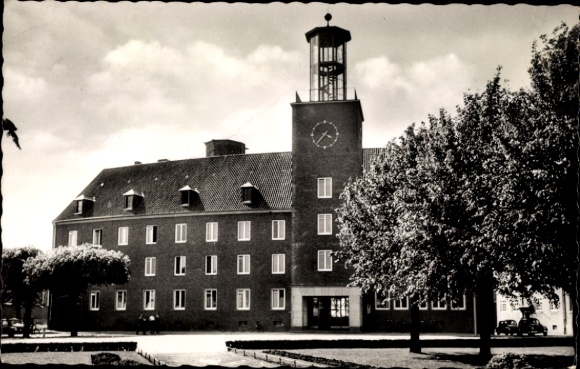PC Hoch Elten Emmerich am Rhein, building with tower and clock, trees in the foreground, black and white...