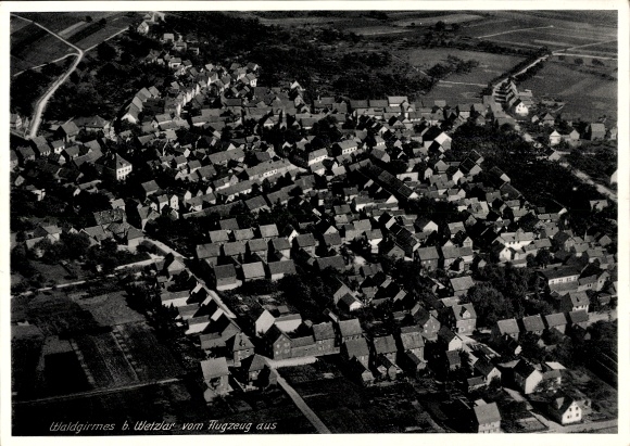 Postcard Waldgirmes Lahnau in Hesse, aerial view of numerous roofs, rural surroundings
