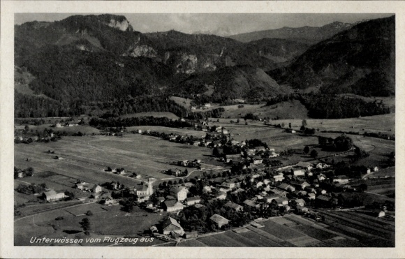 Postcard Unterwössen in Upper Bavaria, aerial photograph, rural surroundings, mountains, residential buildings, arable land