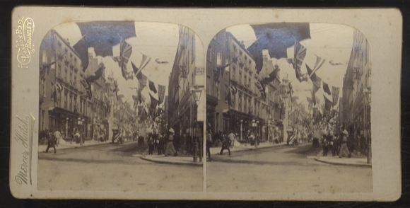 Stereo photo, a busy shopping street in London decorated with flags