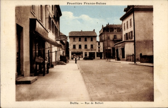 Postcard Delle Territoire de Belfort, Frontière Franco-Suisse, Rue de Belfort, city view, shops