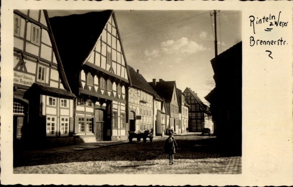 Postcard Rinteln on the Weser, historic half-timbered houses, Brennerstraße, people on the street