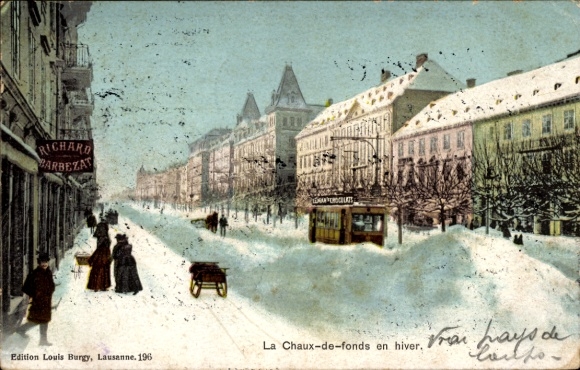 KP La Chaux de Fonds Kanton Neuchâtel, widok miasta zimą, sanie, tramwaj