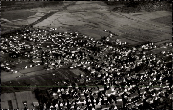 Ak Renningen in Württemberg, Luftaufnahme von  zahlreiche Häuser, landwirtschaftliche Flächen