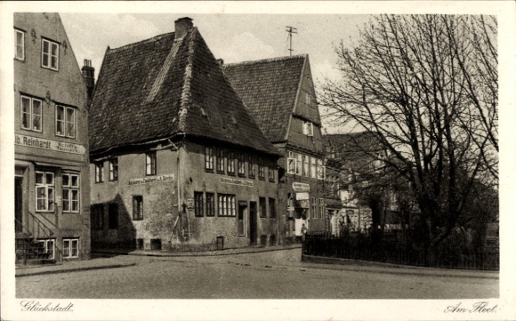Ak Glückstadt an der Elbe, Am Fleet, Geschäftshaus Reinhardt