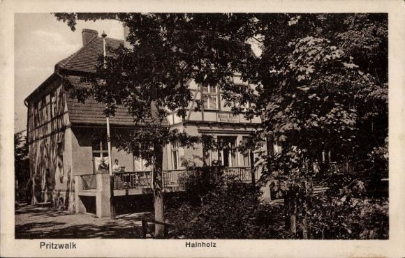 Postcard Pritzwalk in the Prignitz, house with balcony, trees in the foreground, two people on the balcony