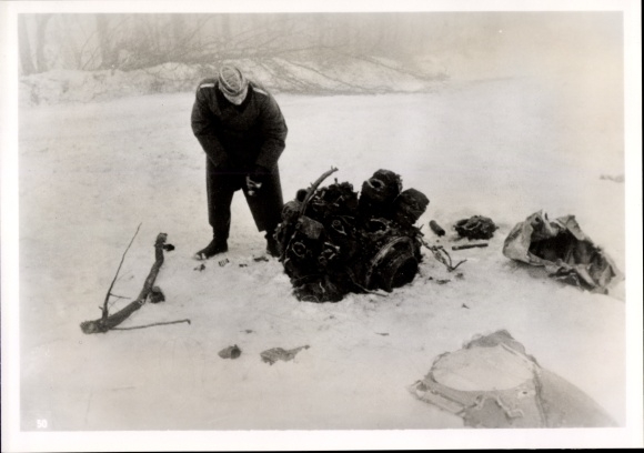 Photo of a Wehrmacht soldier with the remains of a French aircraft, February 1940, WWII