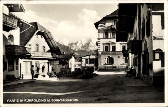 Ruhpolding in Upper Bavaria, street in building, mountains in the background
