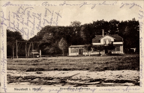 PC Neustadt in Holstein, house, trees, writing on the edge, text 'Strandhaus Eichenhain', text 'Neu...