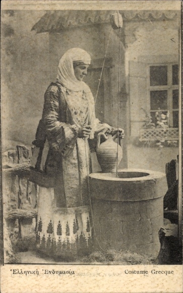 Postcard Greek woman in traditional costume at a fountain