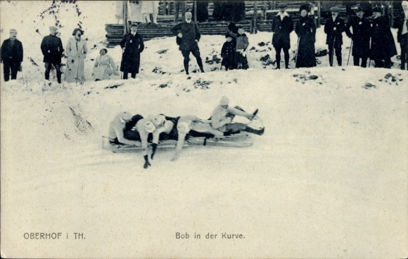 Postcard Oberhof in the Thuringian Forest, bobsleigh in the curve, spectators