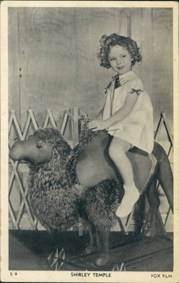 Postcard Actress Shirley Temple sitting on plush camel