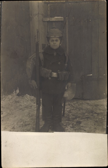 Photo Postcard boy in uniform with rifle and field pack, spiked helmet