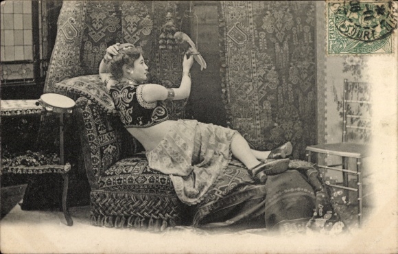 Postcard woman in oriental costume with parrot