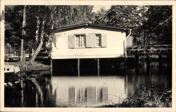 Postcard Kremmen in der Mark, house on the water, wooden jetty, trees, boats in the foreground