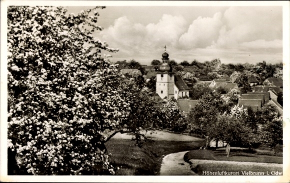 Postcard Vielbrunn Michelstadt in the Odenwald, pretty village with church, river, trees, clouds in the sky, n