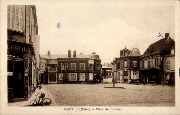 Postcard Damville Eure, Place de Laloue, buildings, cyclists, rows of shops