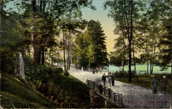 Postcard Bad Nauheim in Hesse, park with trees, walkers, path, pond, nature