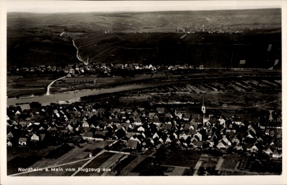 Postcard Nordheim am Main Lower Franconia, aerial view of Nordheim, houses and church, landscape