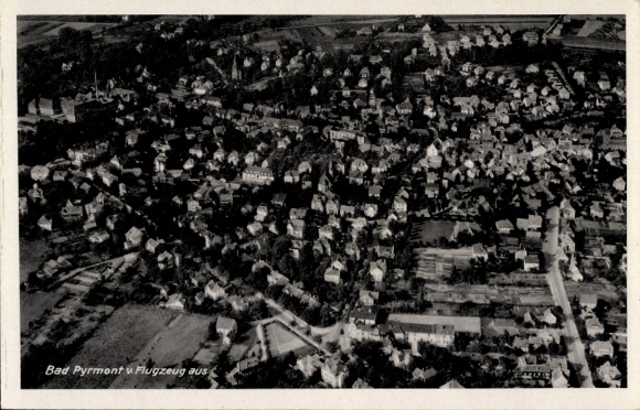 Postcard Bad Pyrmont in Lower Saxony, aerial photograph of many houses, from airplane, black and white
