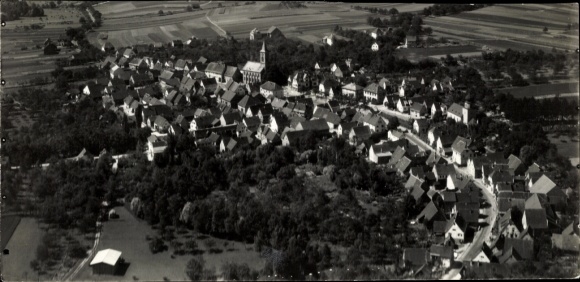 Postcard Schlüchtern in Hesse, a village with a church, surrounded by fields and meadows