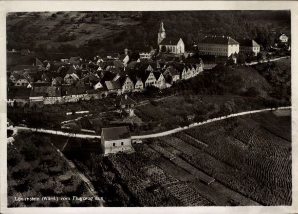 Postcard Löwenstein in Württemberg, aerial view of Löwenstein, houses, church, vineyards, aircraft photo