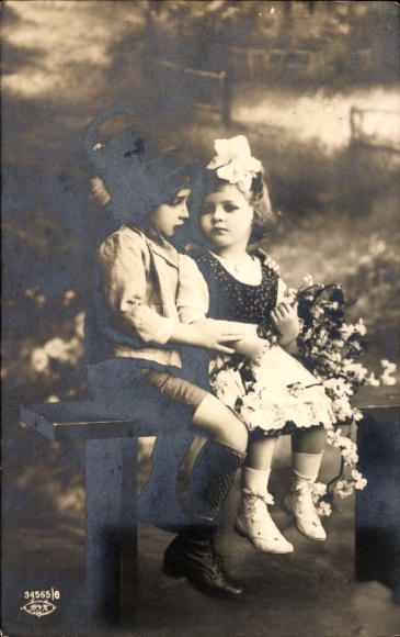 Postcard children as a couple in love with flowers