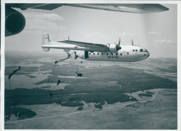 Photo German military aircraft in the air, parachutists jumping, GB 110, Bundeswehr