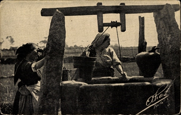 PC Portugal, two women in traditional costume, fountain