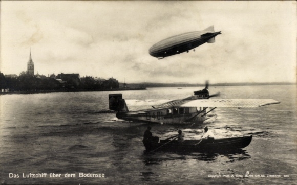 Postcard Bodensee, Zeppelin airship LZ 126 ZR III, seaplane Dornier Delphin II, D 401, rowing boat