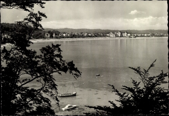 Picture of the seaside resort of Binz on Rügen, Black Sea, boat in the water, coastal view, trees in the foreground,...