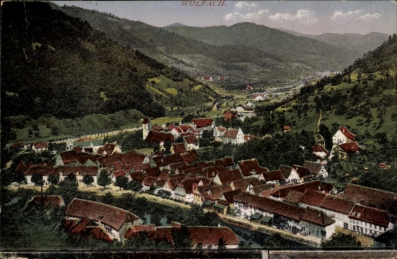 Postcard Wolfach in the Black Forest, landscape view, houses with red roofs, mountains in the background