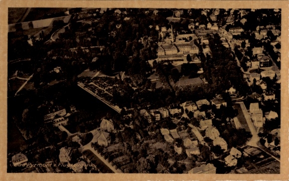 Postcard Bad Pyrmont in Lower Saxony, aerial view of buildings and trees visible