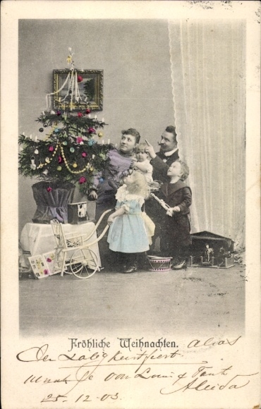 Merry Christmas, family at the Christmas tree