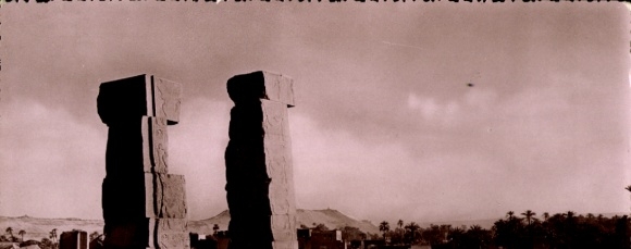 Postcard Assouan Aswan Egypt, Two large stone pillars, text about Alexander the Great, sepia tone