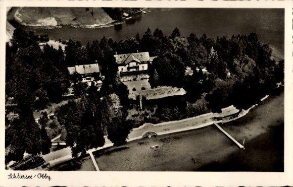 Postcard Schliersee Upper Bavaria, Ankelalm, aerial view of a house, forest, lake, promenade, boat mooring
