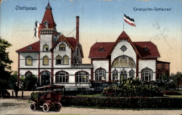 Ak Oberhausen im Ruhrgebiet,  Kaisergarten-Restaurant, Gebäude mit Fahnen, Auto