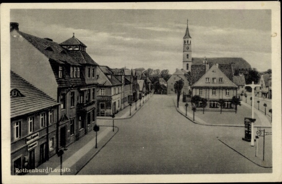 Postcard Rothenburg in der Oberlausitz, street section with church, commercial buildings, plumbing shop Max Kapisch